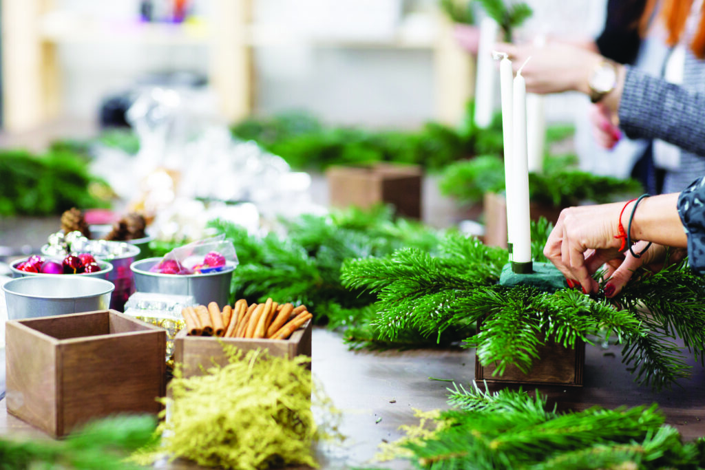 People making festive centrepieces